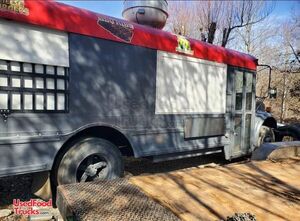 34' International 3800 Bustaurant Custom Built Barbecue Food Truck with Built-In Smokers.