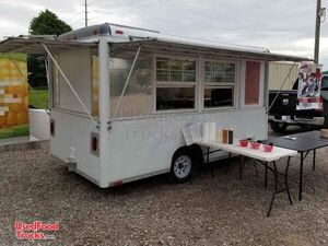 Ready to Serve Wells Cargo 7' x 12' Mobile Food Concession Trailer.