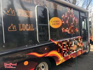 GMC Stepvan Food Truck with an Open BBQ Smoker Trailer.