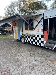 2001 - 30' Workhorse P42 Kitchen Food Truck with a BBQ Smoker on a Trailer.