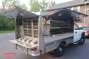 2006 GMC Sierra 2500 HD Lunch Serving Food Truck with a Refrigerated Wag Catering Box.