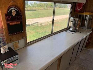 2007 Food Concession Trailer with an Extra Trailer and a Towable Smoker on a Trailer.